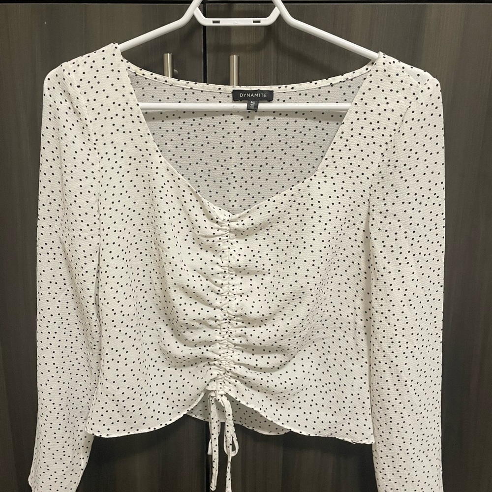 White and black polka dot blouse